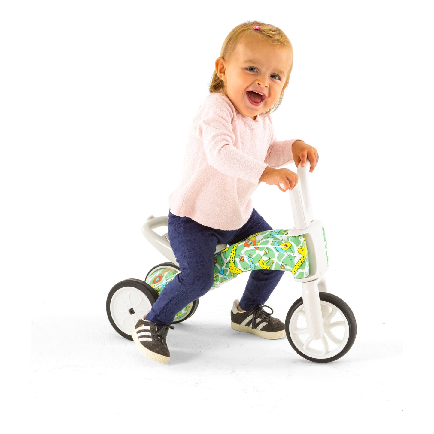 smiling girl riding Chillafish BUNZI Trike Fad Graffiti