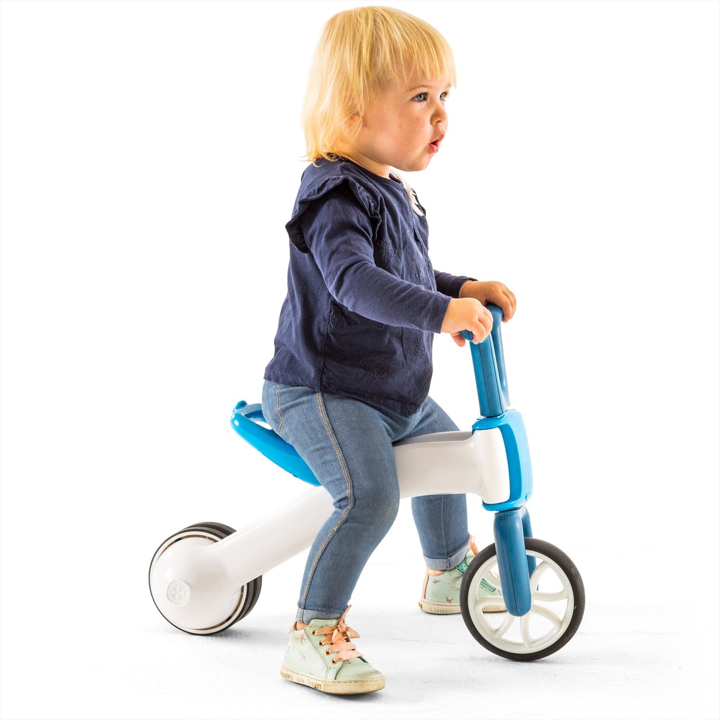 child riding Chillafish BUNZI Trike Blue