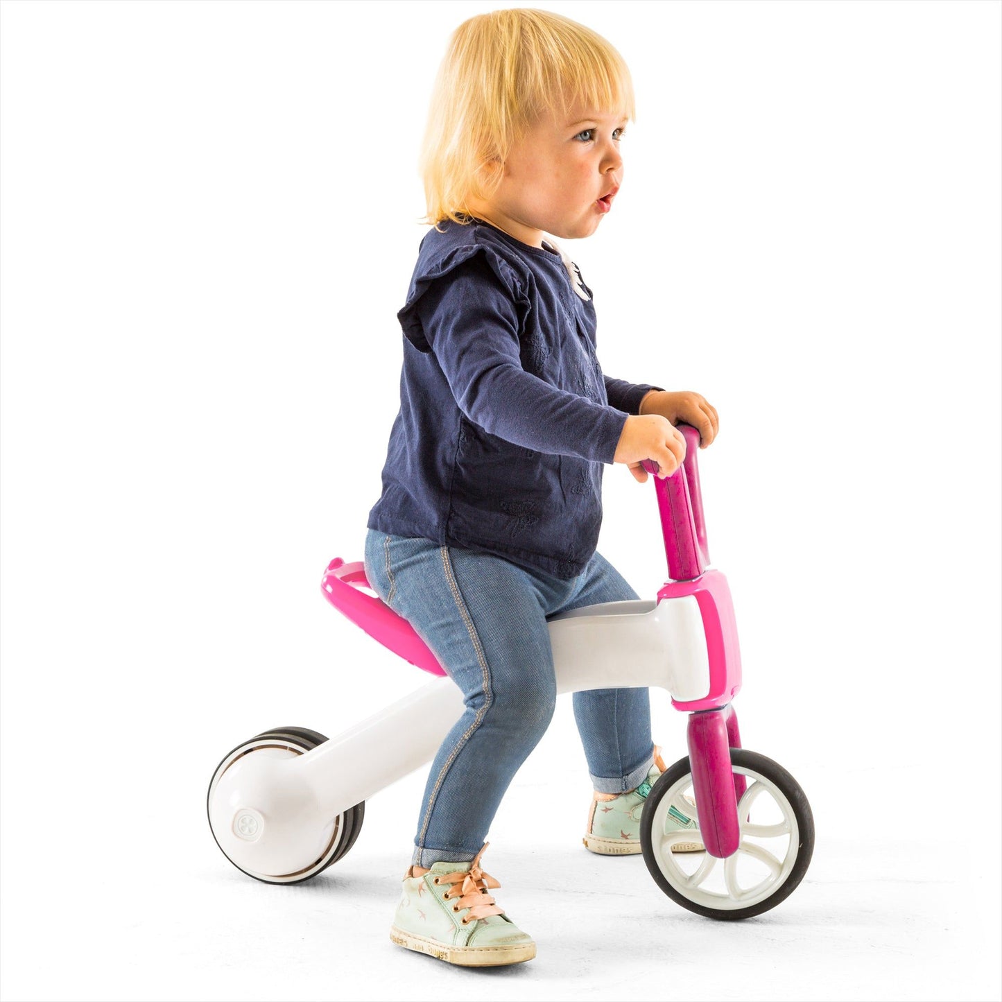 girl riding Chillafish BUNZI Trike Pink