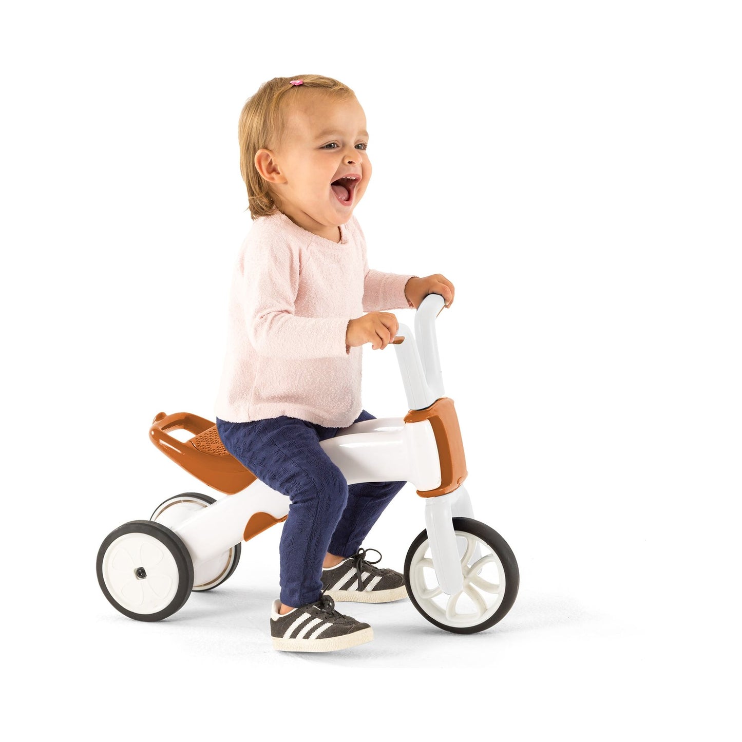 smiling girl riding Chillafish BUNZI Trike Camel