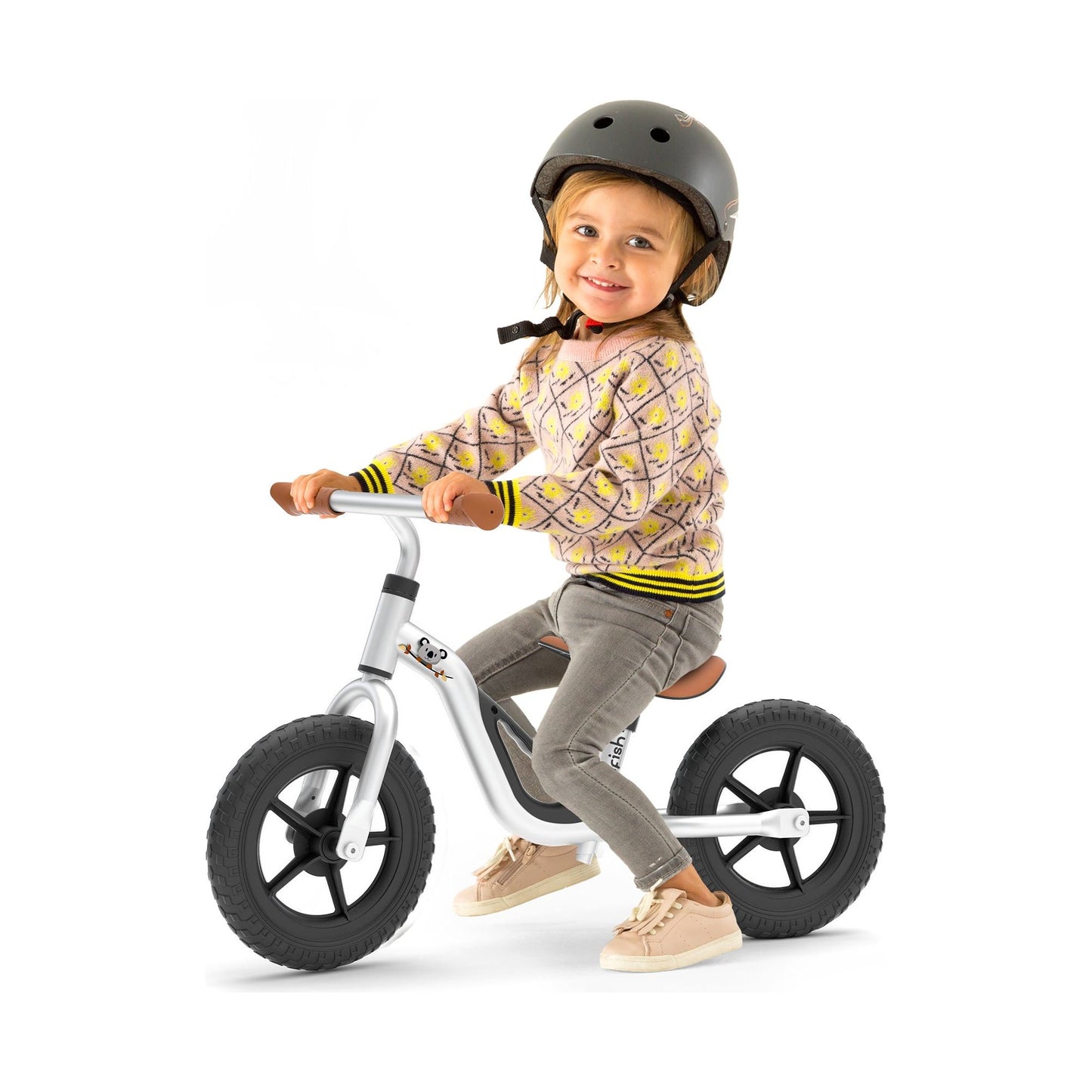 girl sitting on Chillafish Balance Bike Charlie Silver