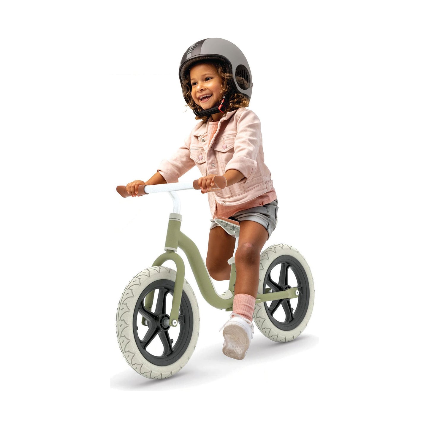 girl riding Chillafish Balance Bike Charlie LUX - Olive