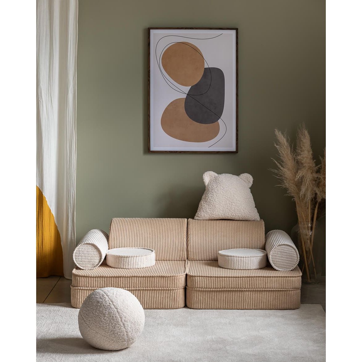 Wigiwama Brown Sugar Settee in lounge  in front of wall art