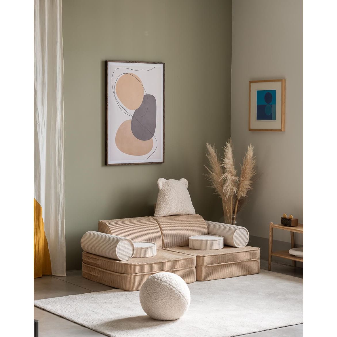 Wigiwama Brown Sugar Settee in lounge with ball cushion on rug