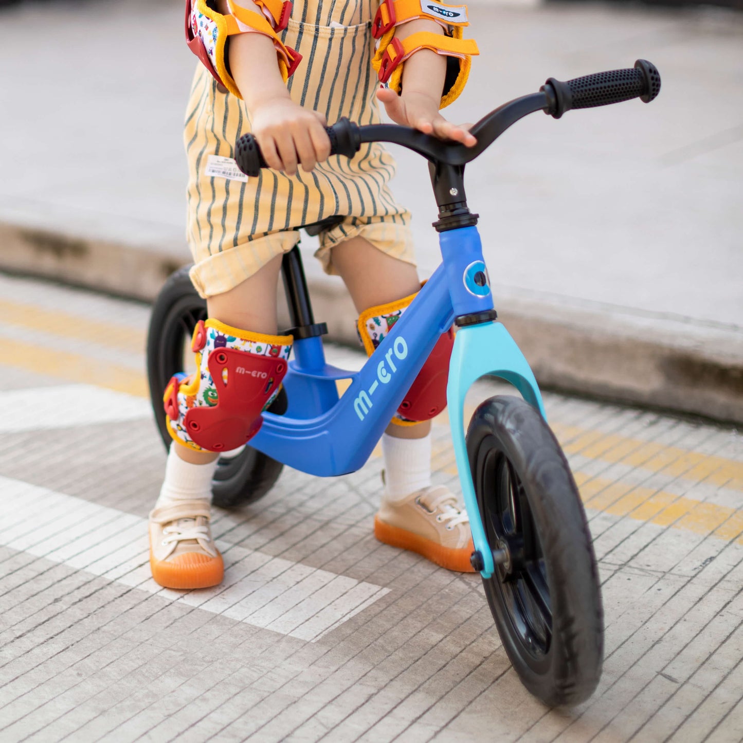 boy riding Micro Scooter Balance Bike Lite Blue