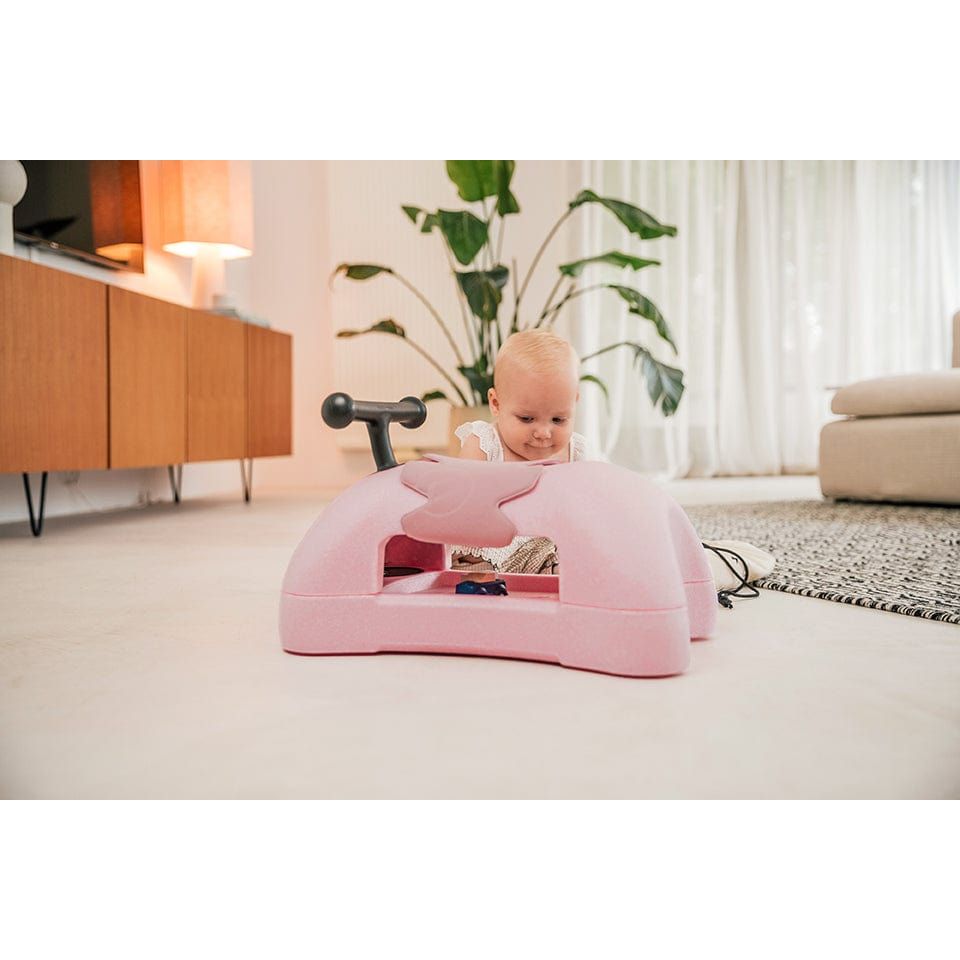 baby looking at Scoot and Ride My First 3-in-1 Baby Walker & Ride on - Rose