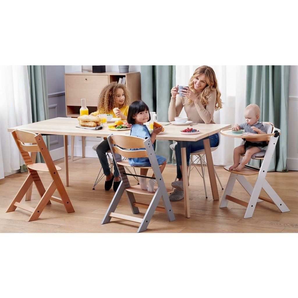woman sitting at dining table with 3 children sitting on Kinderkraft Enock High Chair - Grey