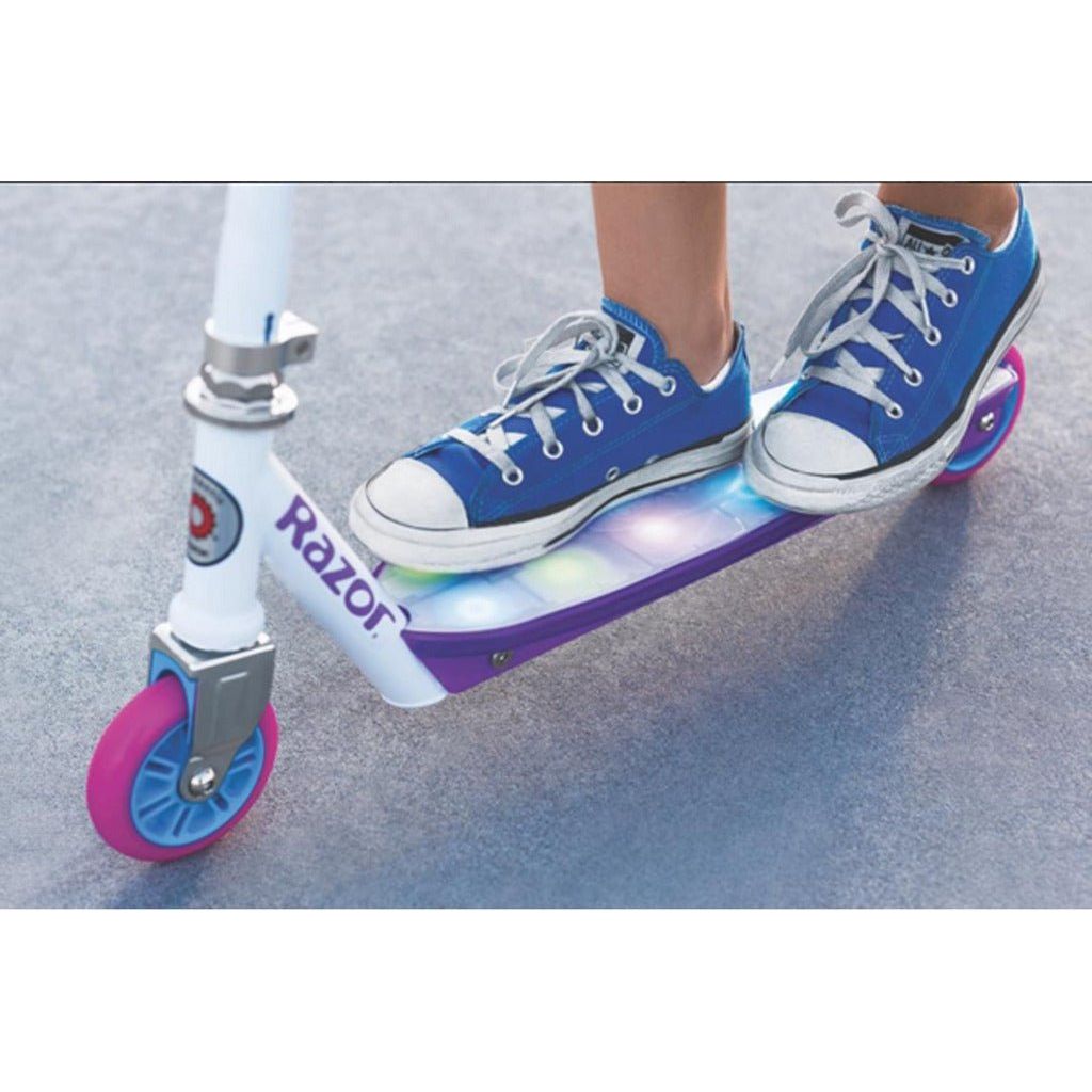 child in blue shoes on Razor Electric Party Pop 10.8V Lithium-ion Scooter
