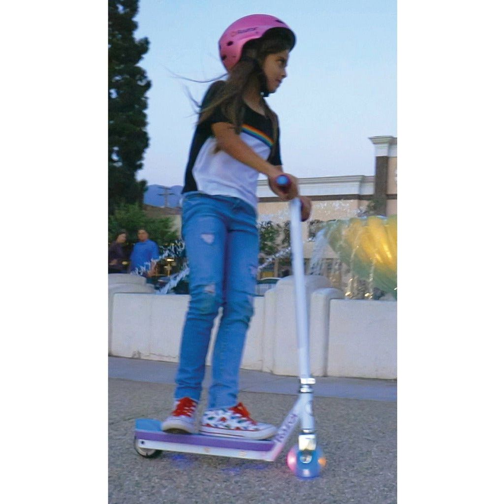 girl in pink helmet riding Razor Electric Party Pop 10.8V Lithium-ion Scooter