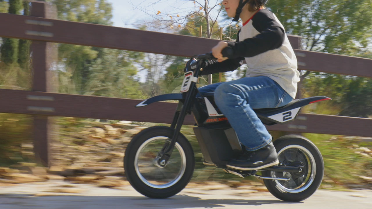 boy riding Razor Dirt Rocket MX125 - Black in woods