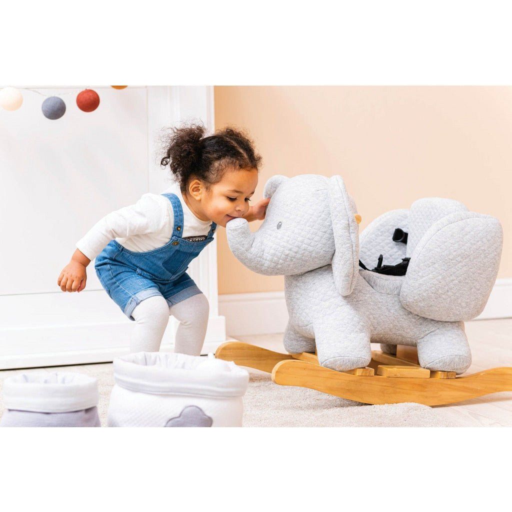 little girl kissing tembo the elephant's trunk