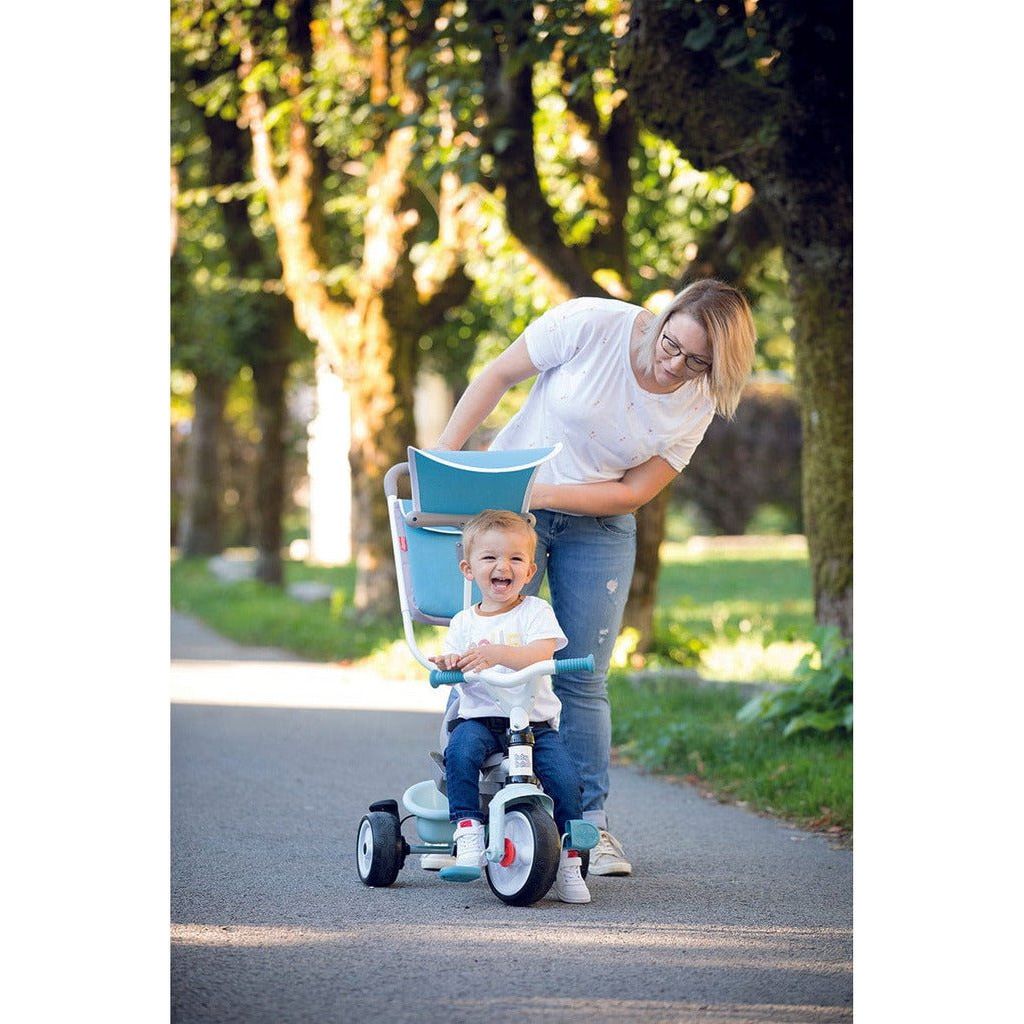 woman pushing toddler in blue Smoby Baby Balade Trike