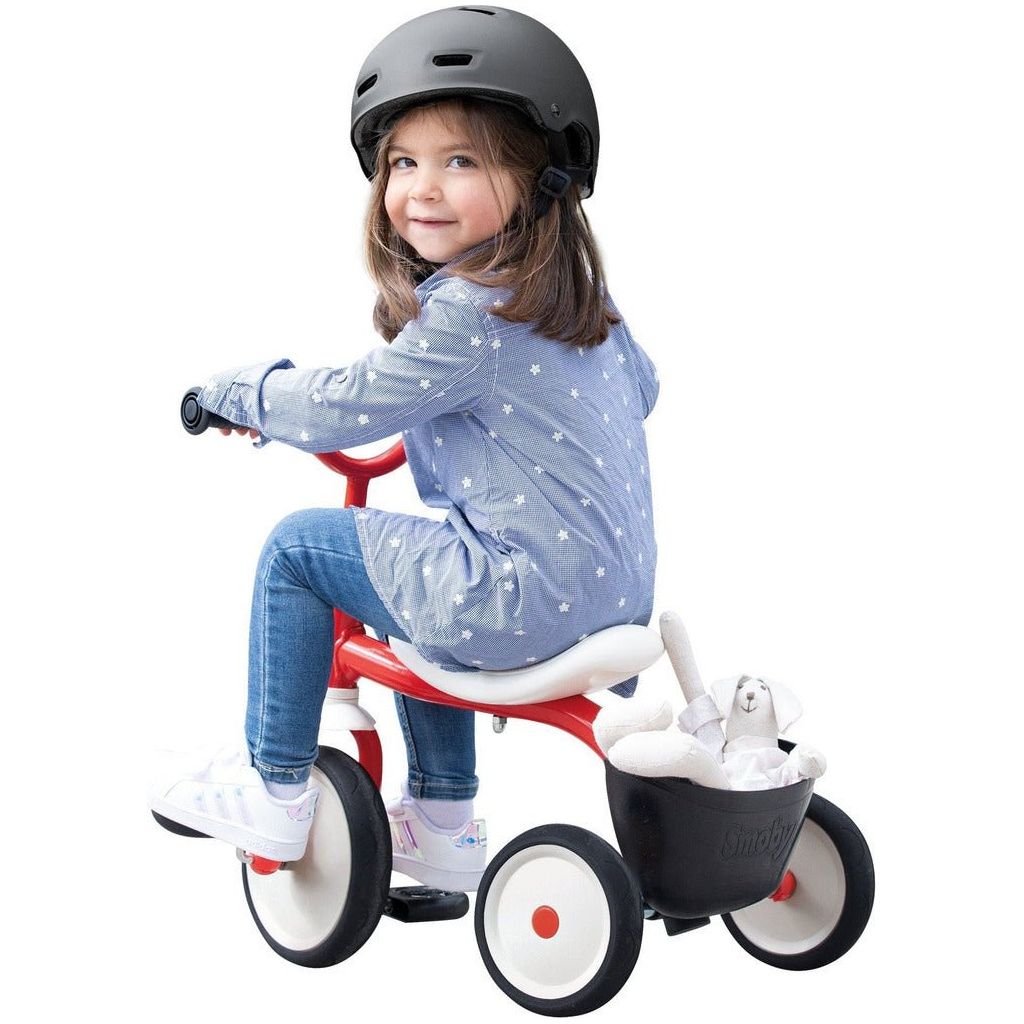little riding Smoby Rookie Tricycle from behind