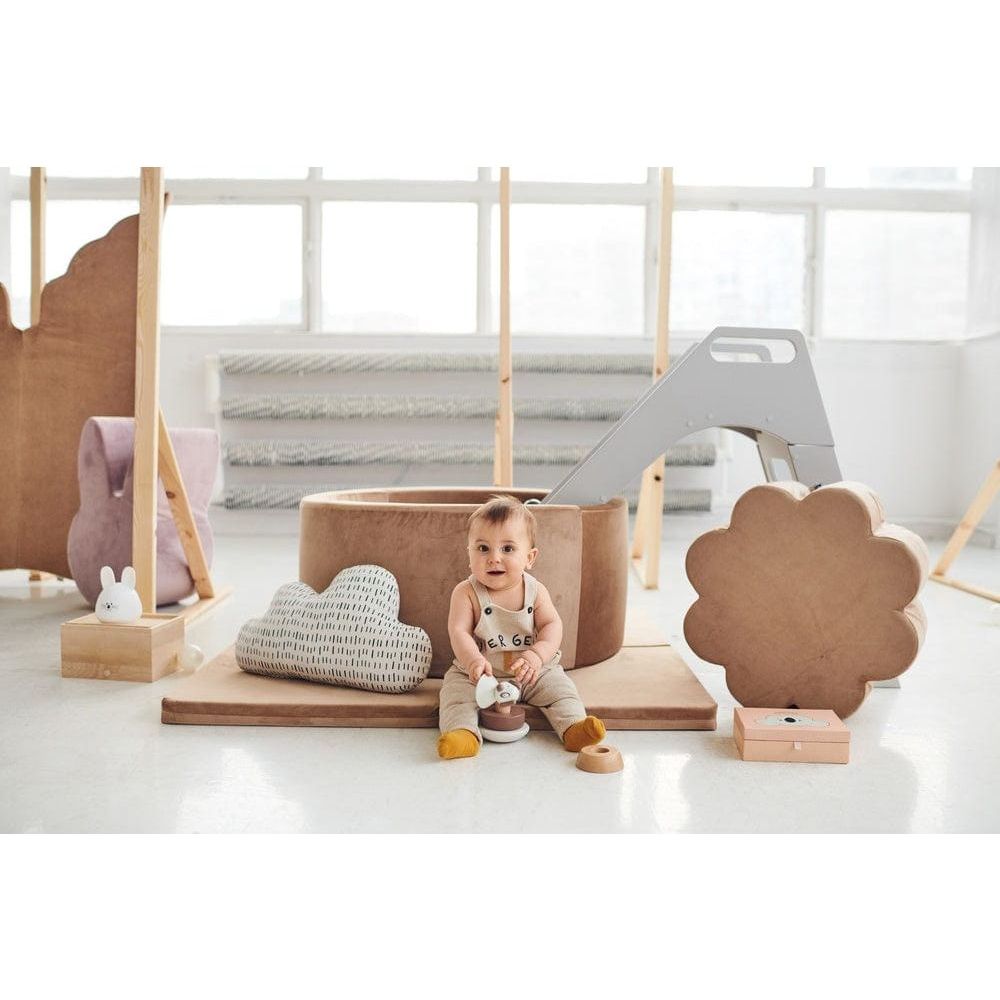 baby sitting in fornt of Misioo Velvet Ball Pit Gold with 200 Balls with wooden slide