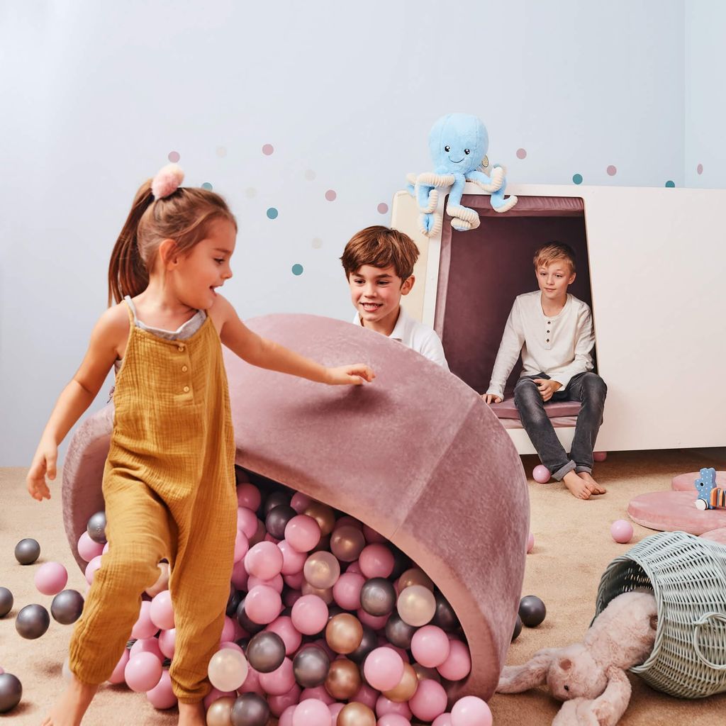 boy tipping over Misioo Velvet Ball Pit Pink with 200 Balls