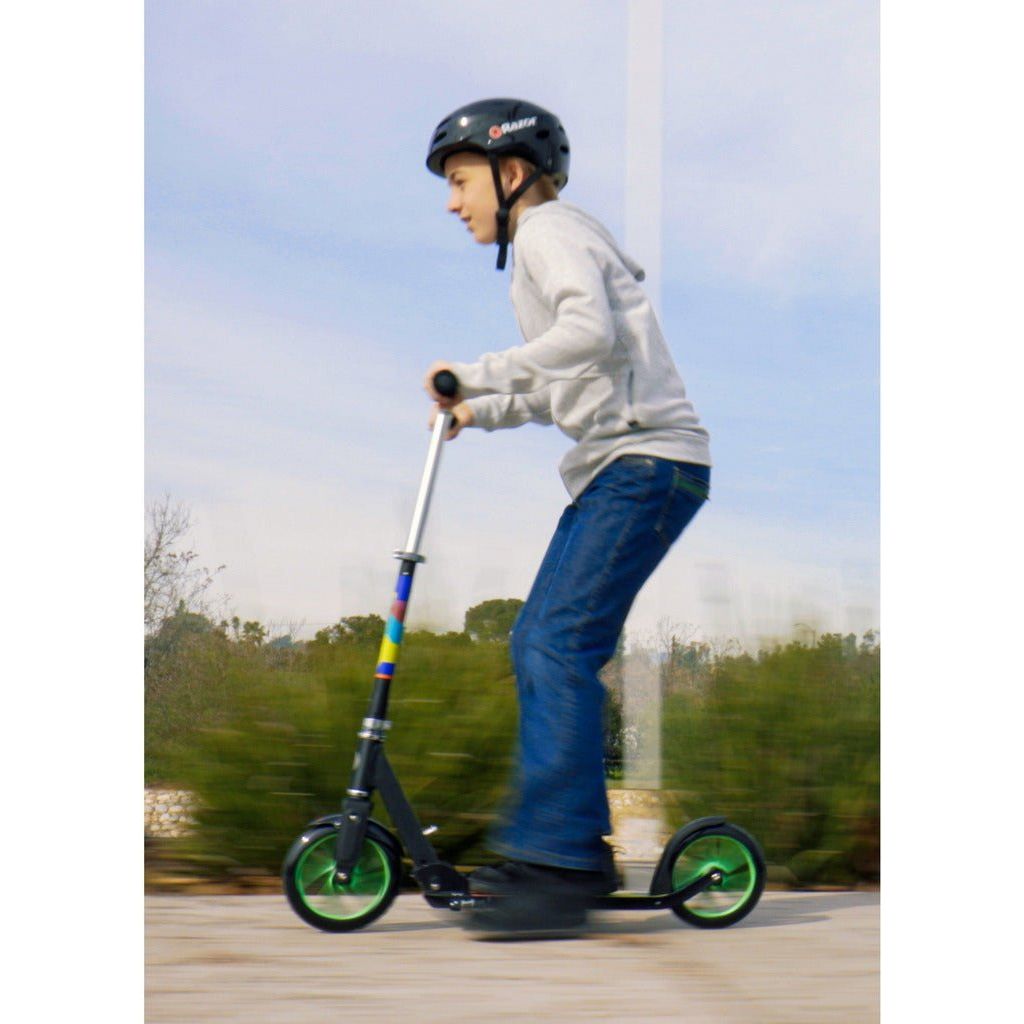 boy riding quickly on Razor A5 LUX Lighted Scooter - Green