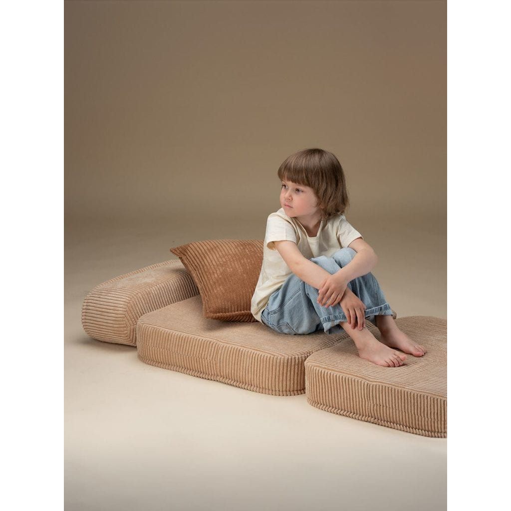 girl sitting on Wigiwama Brown Sugar Flip Chair