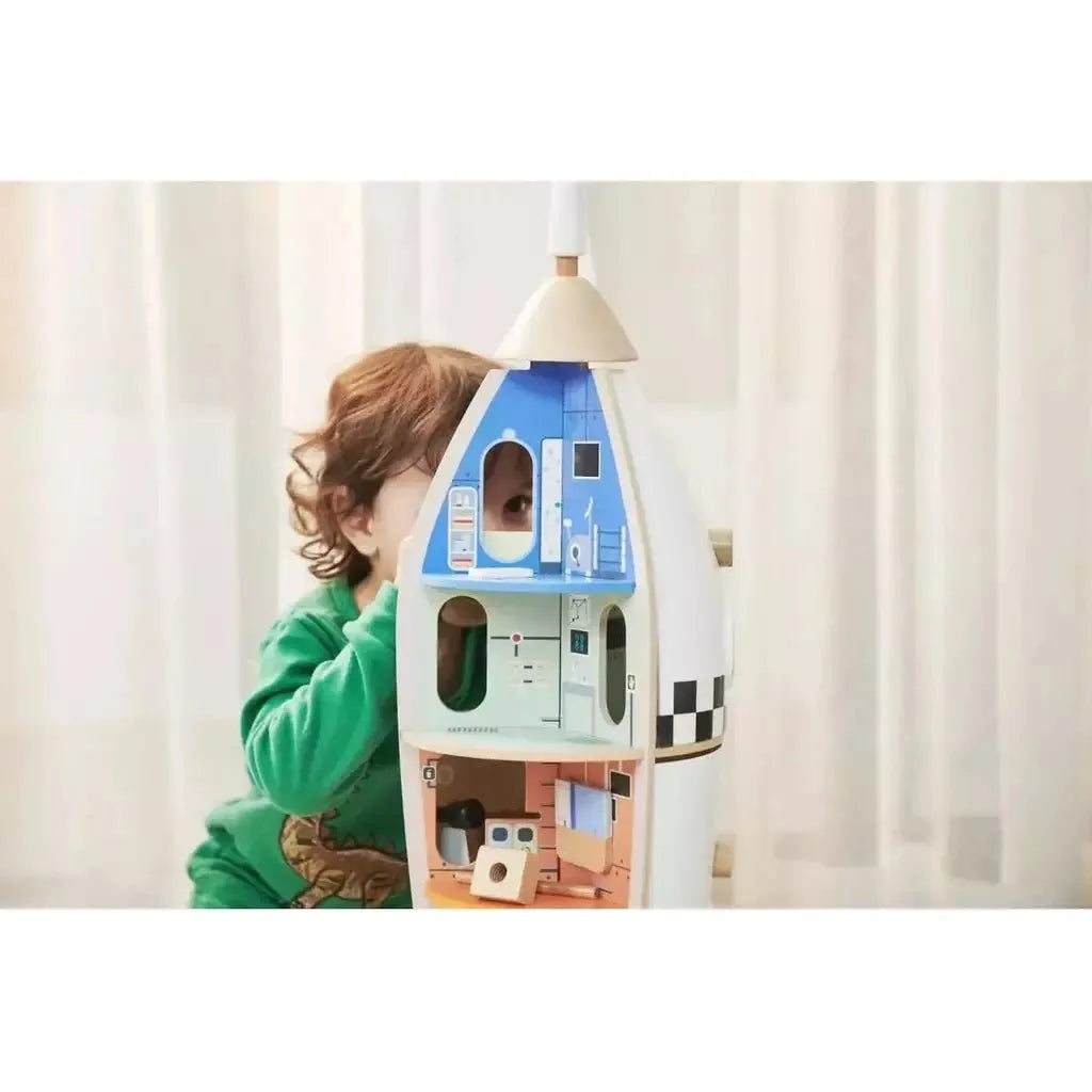 close up of child playing with Classic World Wooden Rocket Ship
