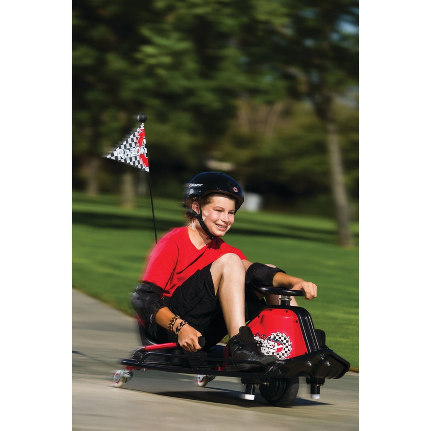 boy riding Razor Crazy Cart 24 Volt Drift Machine