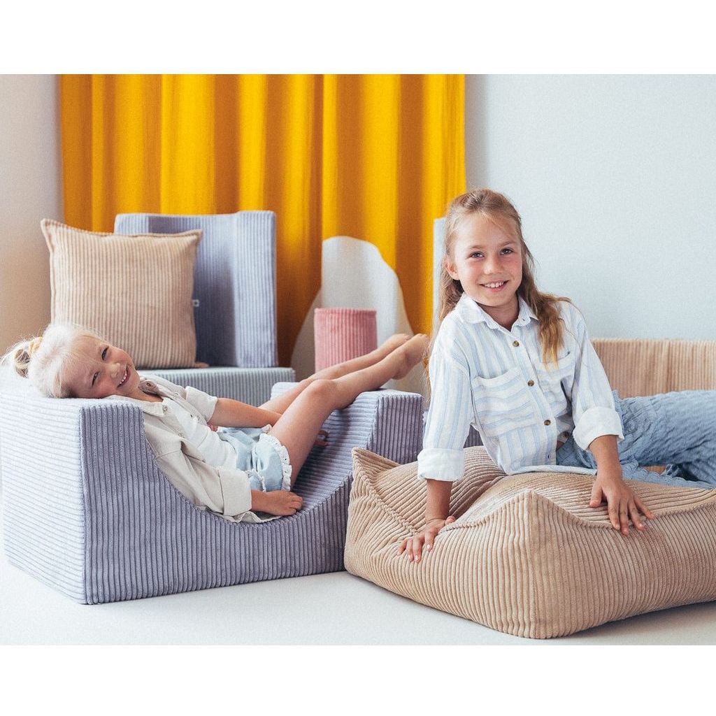 close up of girls sitting on Wigiwama Blueberry Blue Rainbow Softplay Set