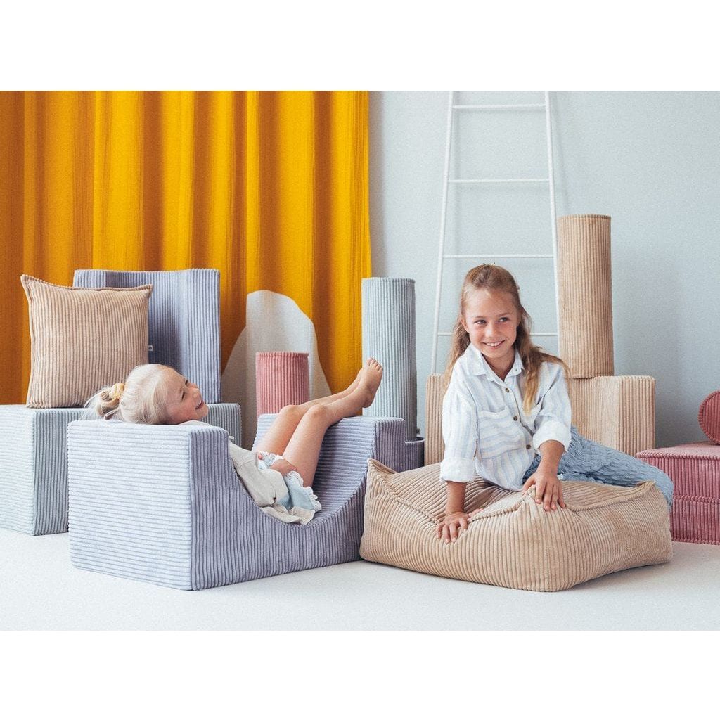 girls sitting on Wigiwama Brown Sugar Roll Cushions