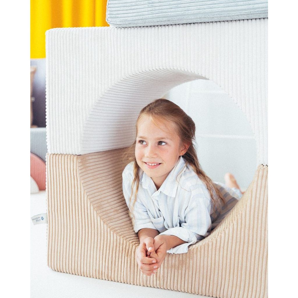 girl inside tunnel created with Wigiwama Marshmallow Rainbow softplay set