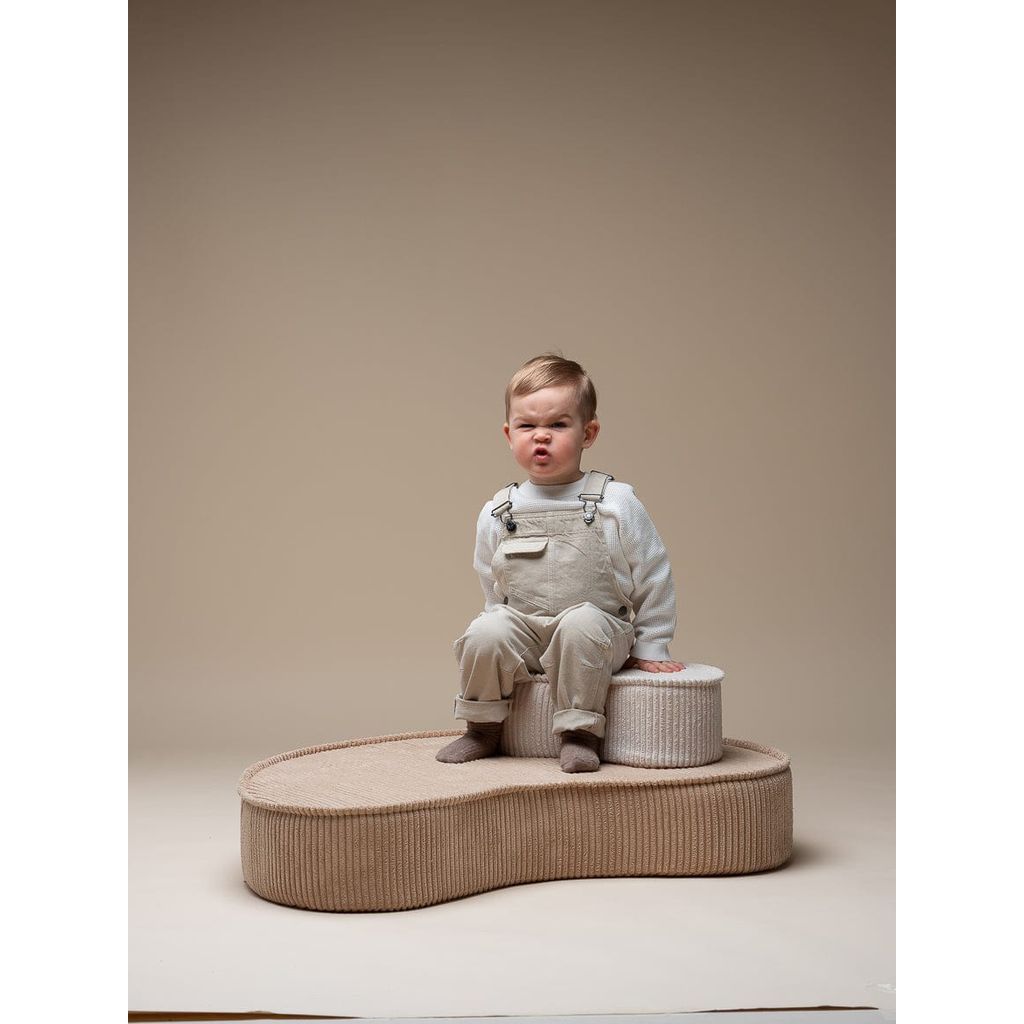 boy sitting on Wigiwama Brown Sugar Lounge Chair
