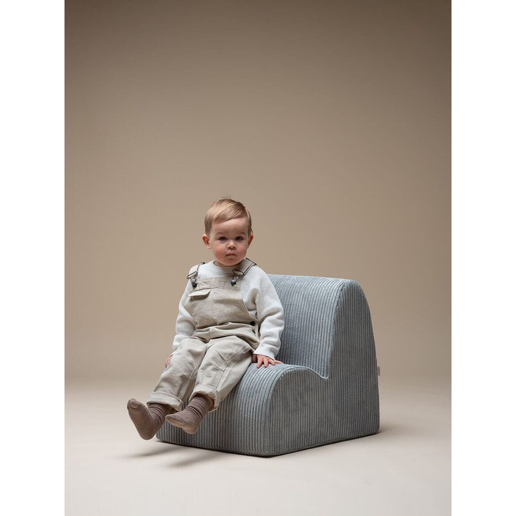 boy sitting on Wigiwama Peppermint Green Kids Cloud Chair close up
