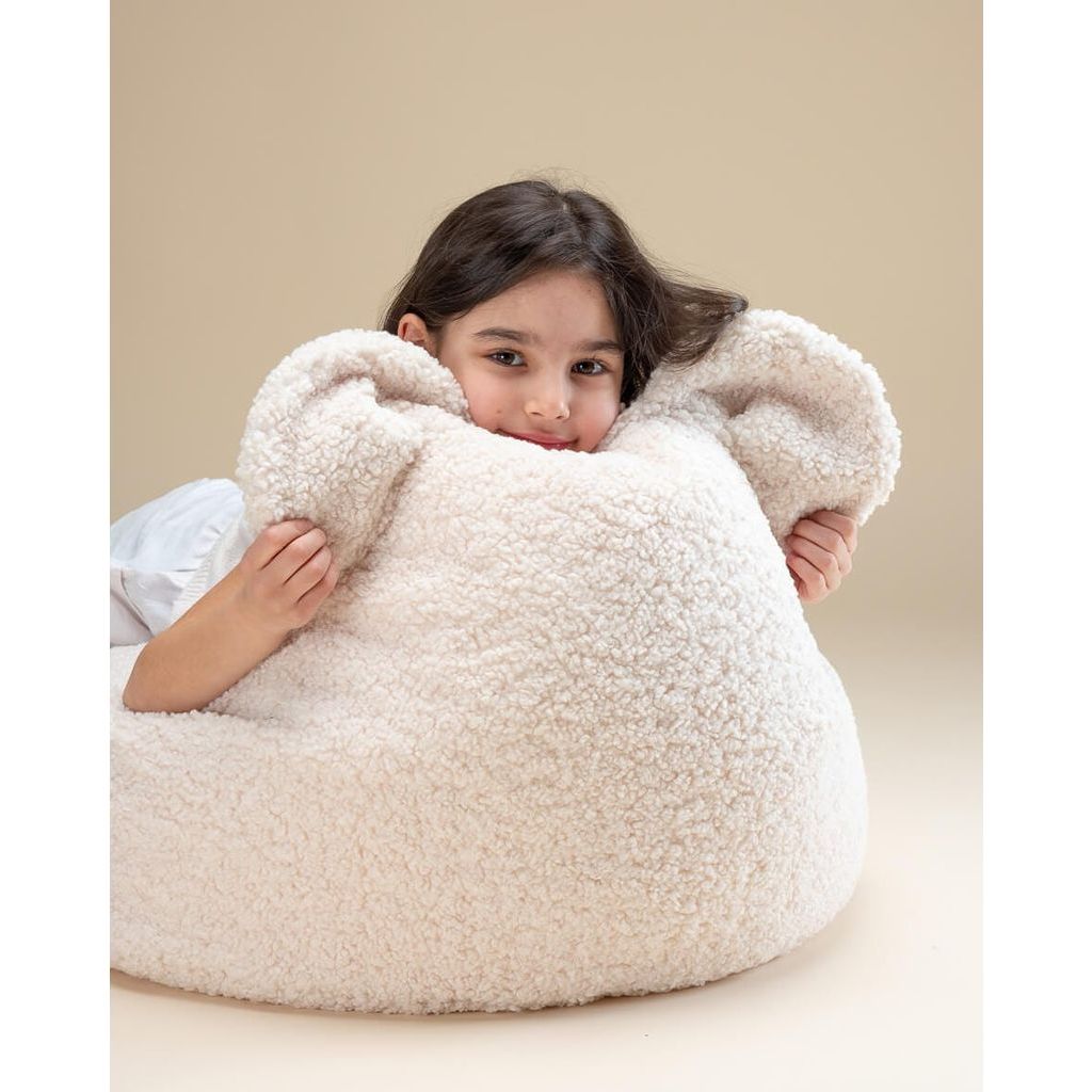 girl leaning on Wigiwama Cream White Bear Beanbag