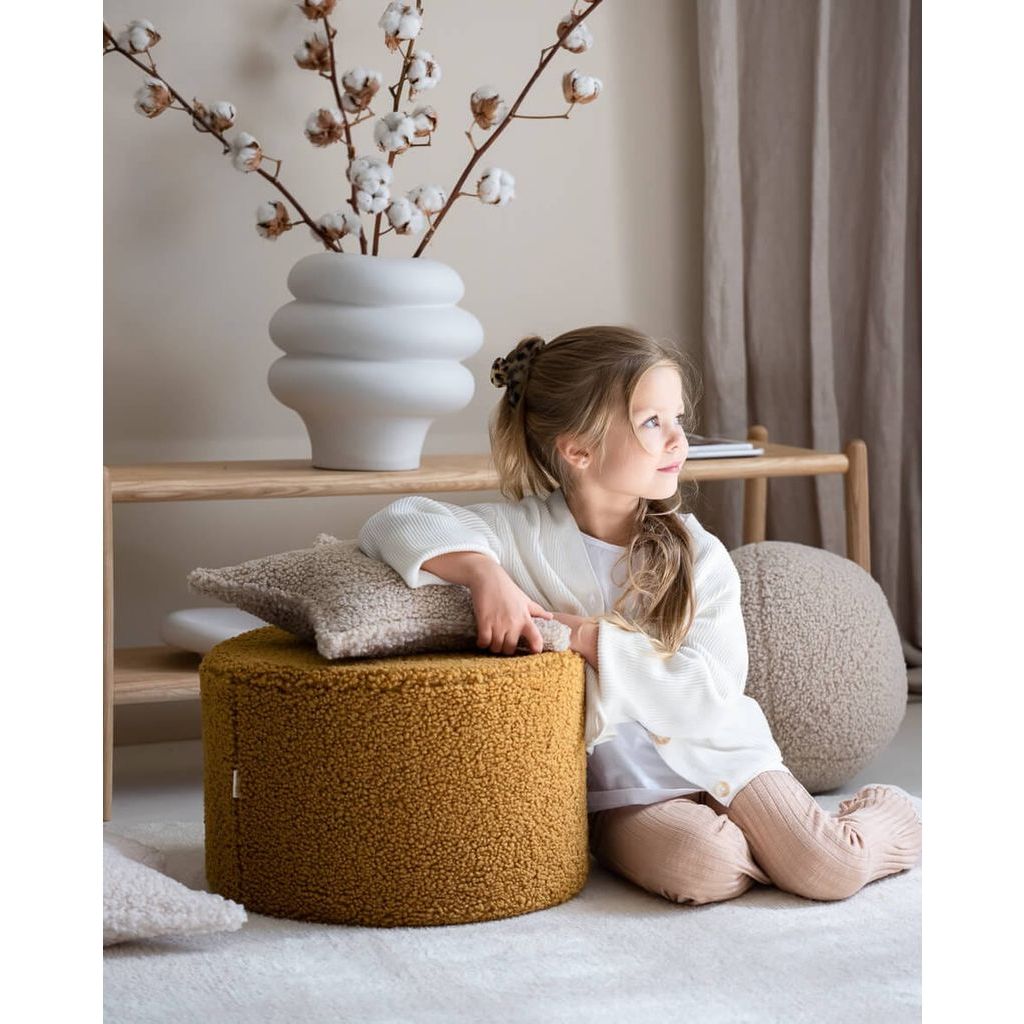 girl leaning against Wigiwama Maple Pouffe