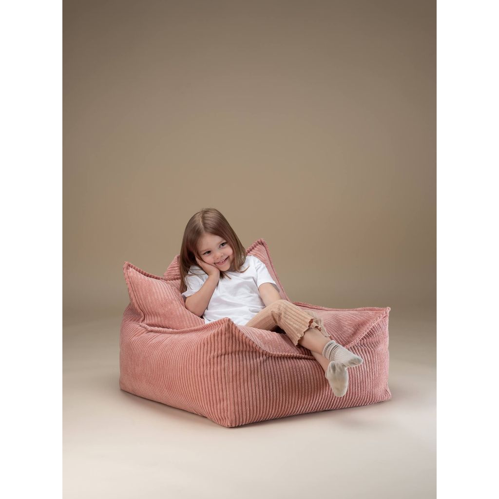 girl lying on Wigiwama Pink Mousse Kids Beanbag Chair