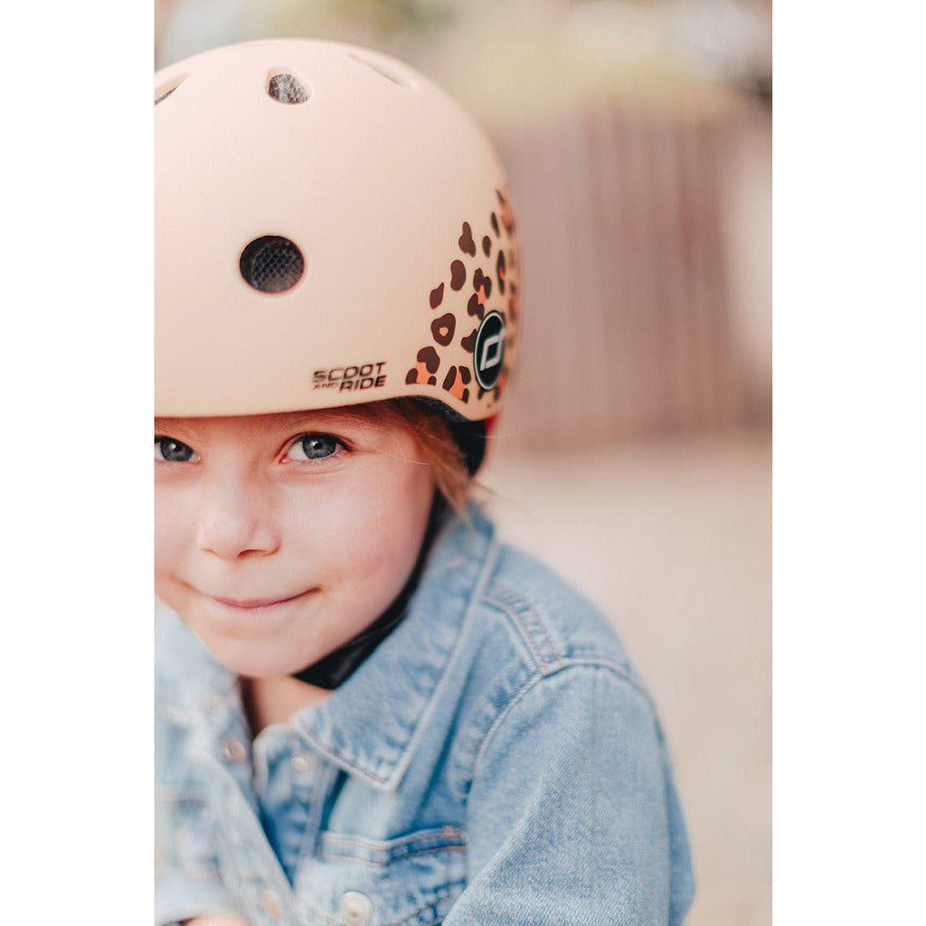 little girl wearing Scoot and Ride Helmet - XXS - S - Leopard