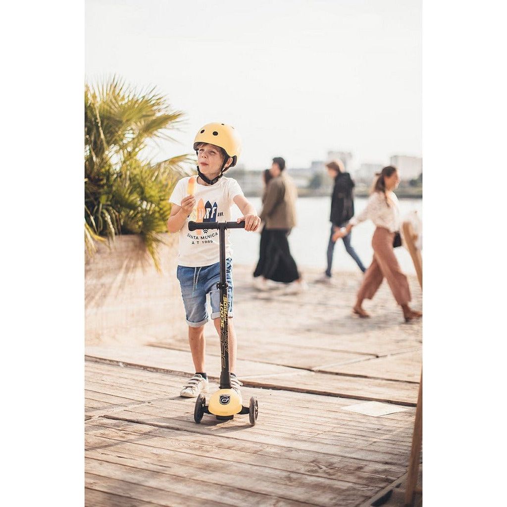 little boy with ice cream riding Scoot and Ride Highwaykick 3 Scooter - Age 3+ - Led Lemon