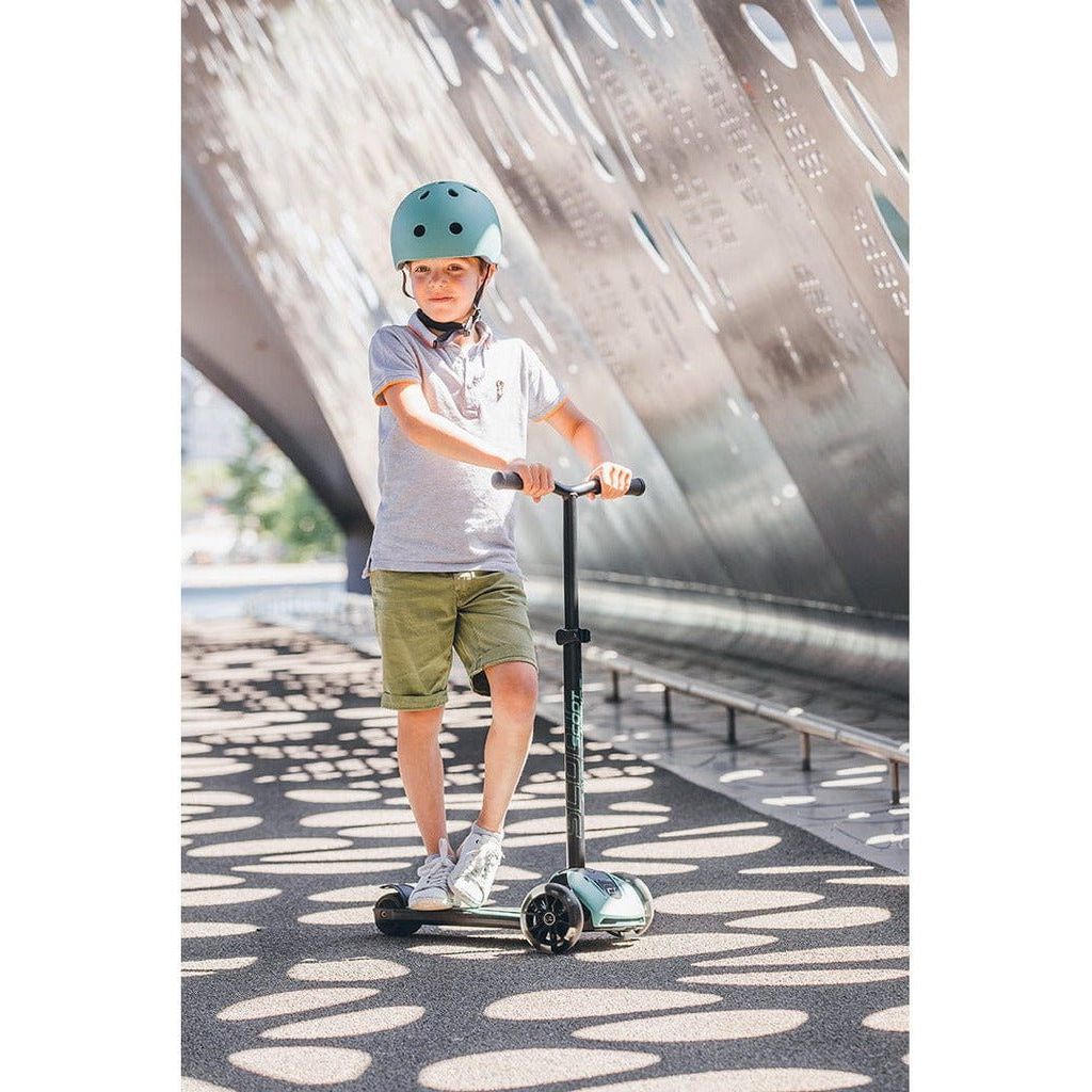 boy riding Scoot and Ride Highwaykick 5 Scooter - Led Forest