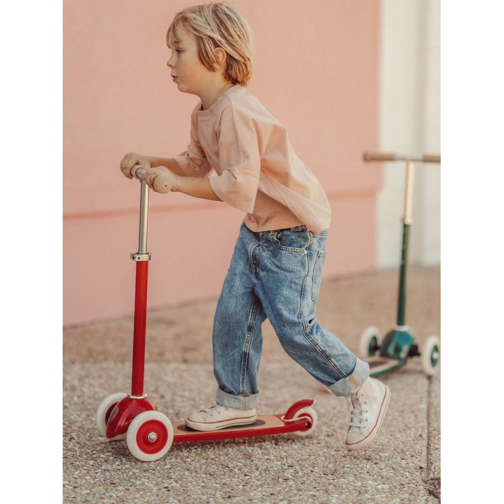Boy riding Banwood Scooter Age 3+ in Red