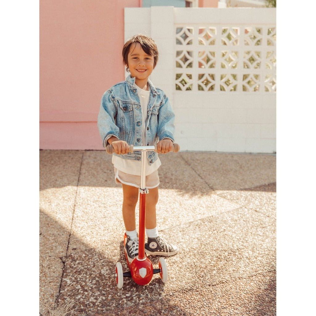 child riding Banwood Scooter Age 3+ in Red