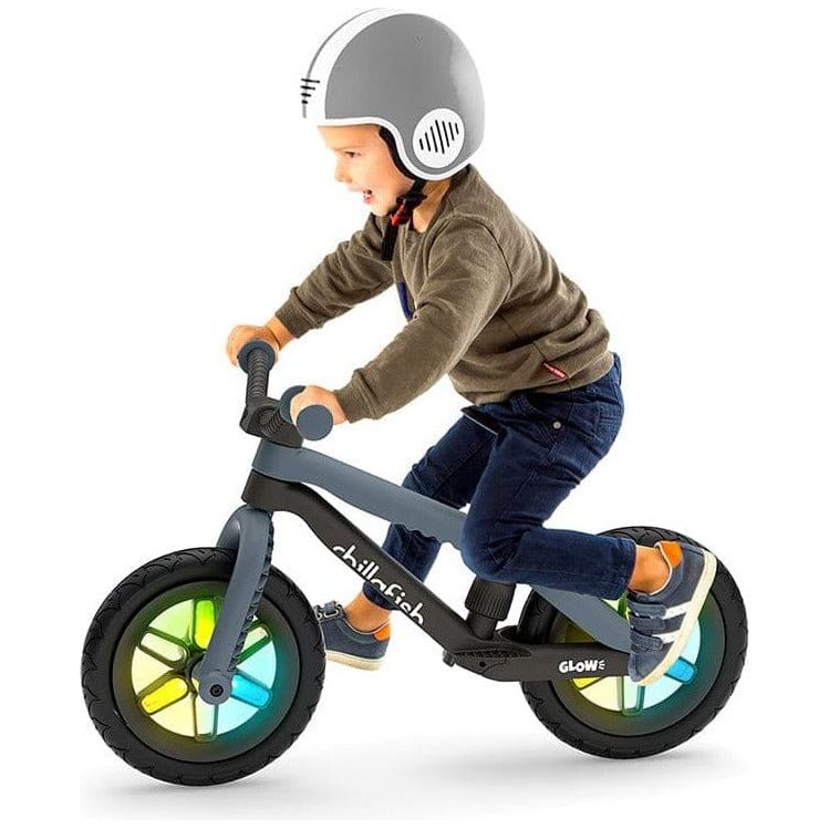 Boy riding Chillafish Bmxie Glow Balance Bike 2-5 Years in Anhracite Grey