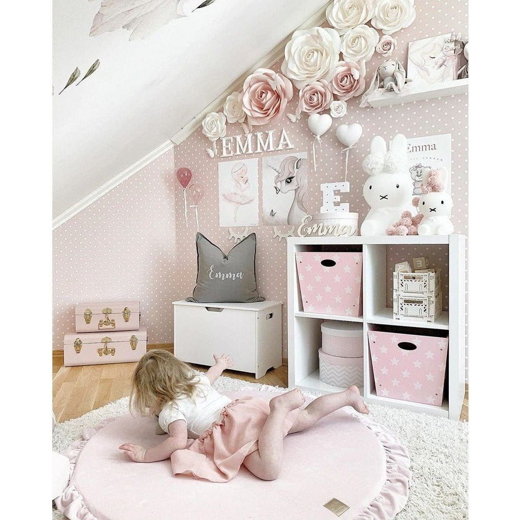 girl lying in pink Meow Baby Round Fill Baby Play Mat in bedroom