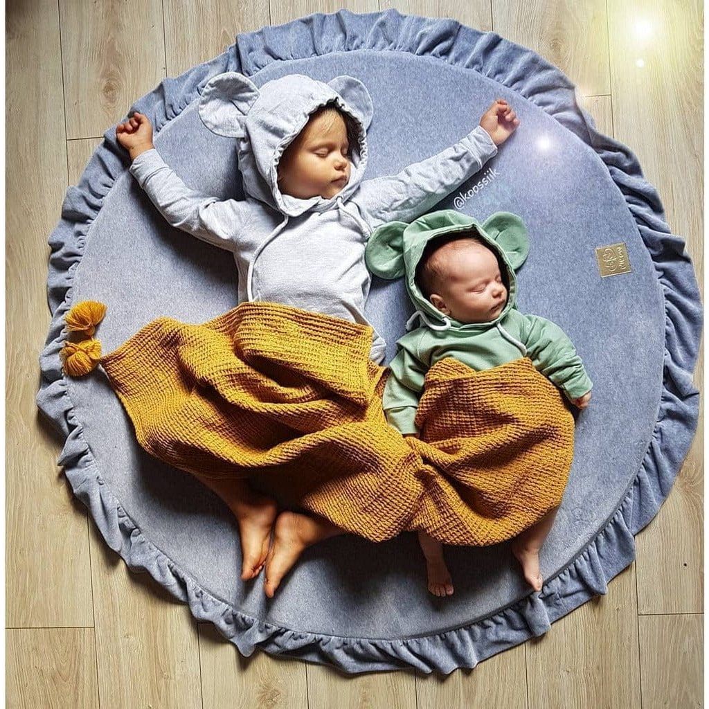 2 babies sleeping on blue Meow Baby Round Fill Baby Play Mat