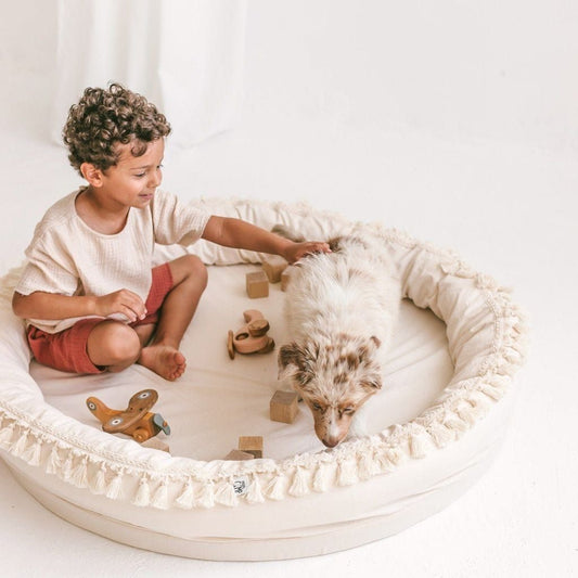 boy and dog sitting in MINICAMP Large Play & Rest Kids Lounger