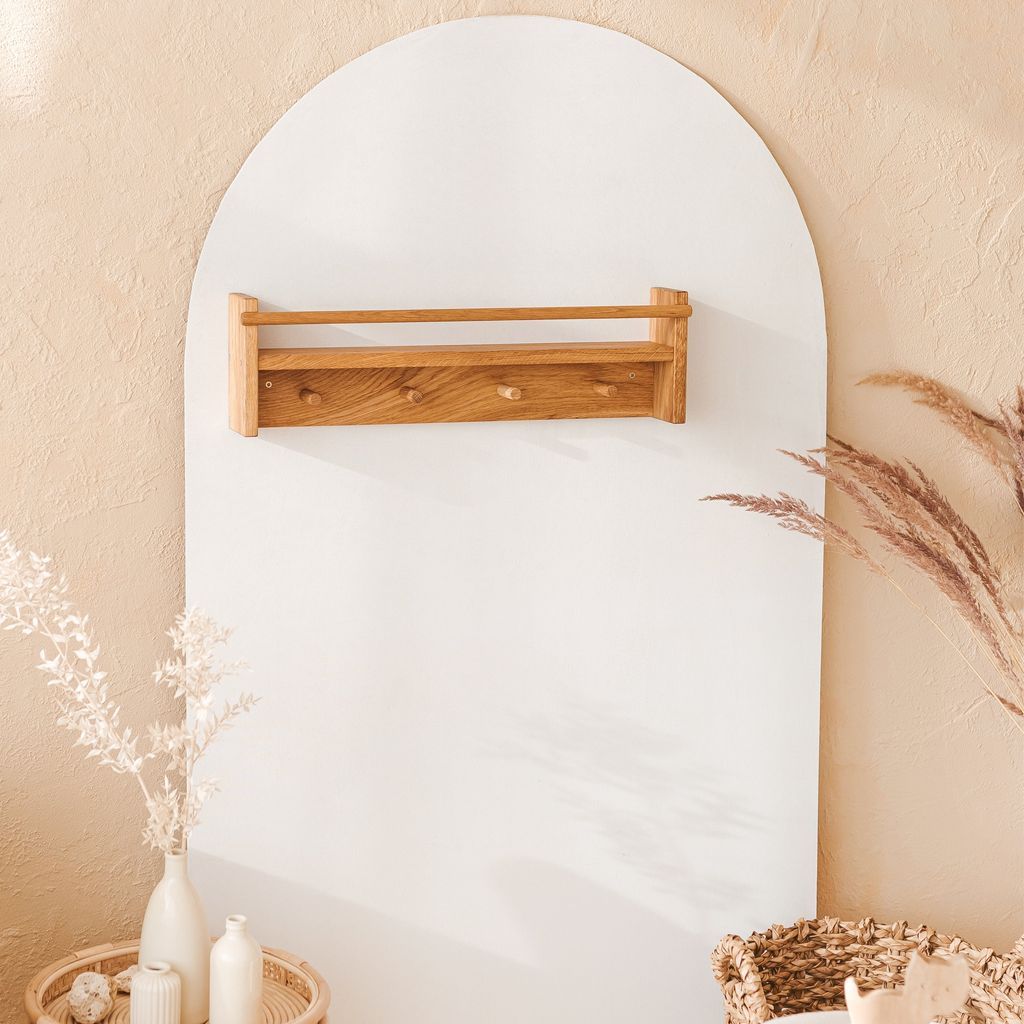 MINICAMP Floating Kids Bookshelf With Coat Hooks Made of Solid Oak on white wall