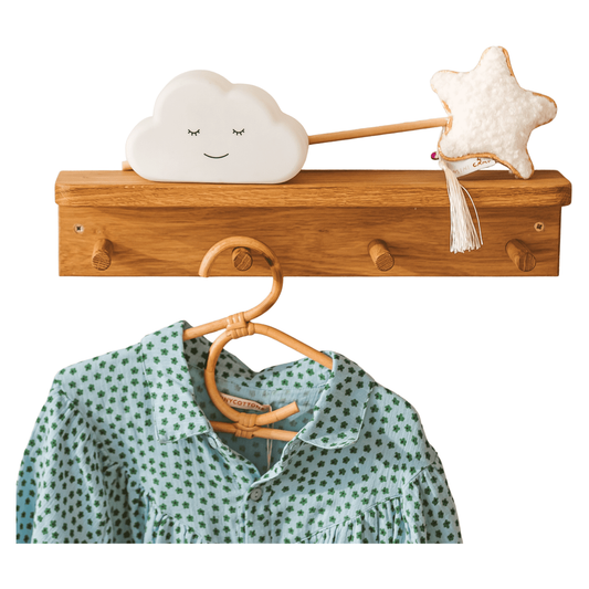 MINICAMP Floating Kids Bookshelf With Coat Hooks Made of Solid Oak with shirt hanging on it