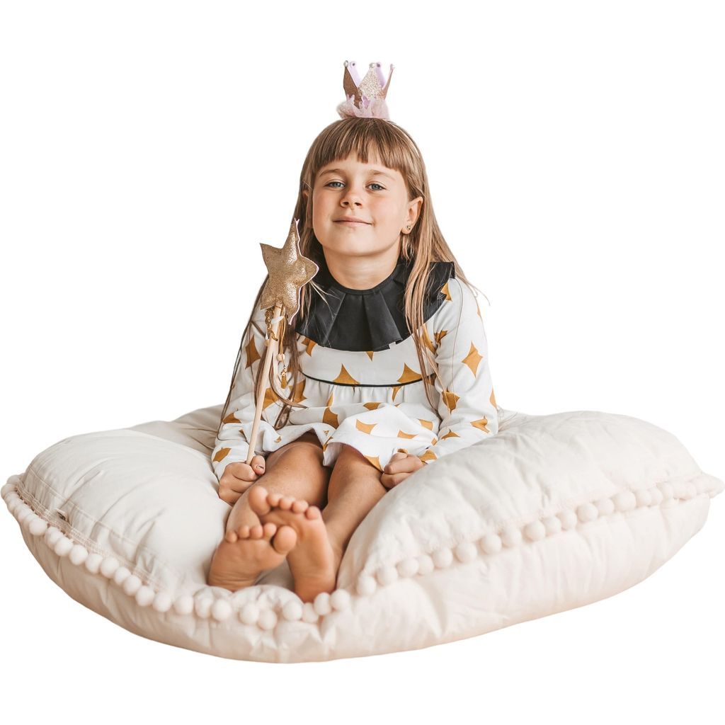 girl with wand sitting on MINICAMP Large Floor Cushion With Pom Poms