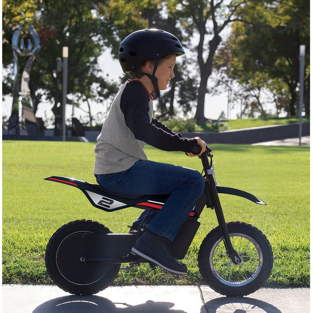 side view of boy riding Razor Dirt Rocket MX125 - Black