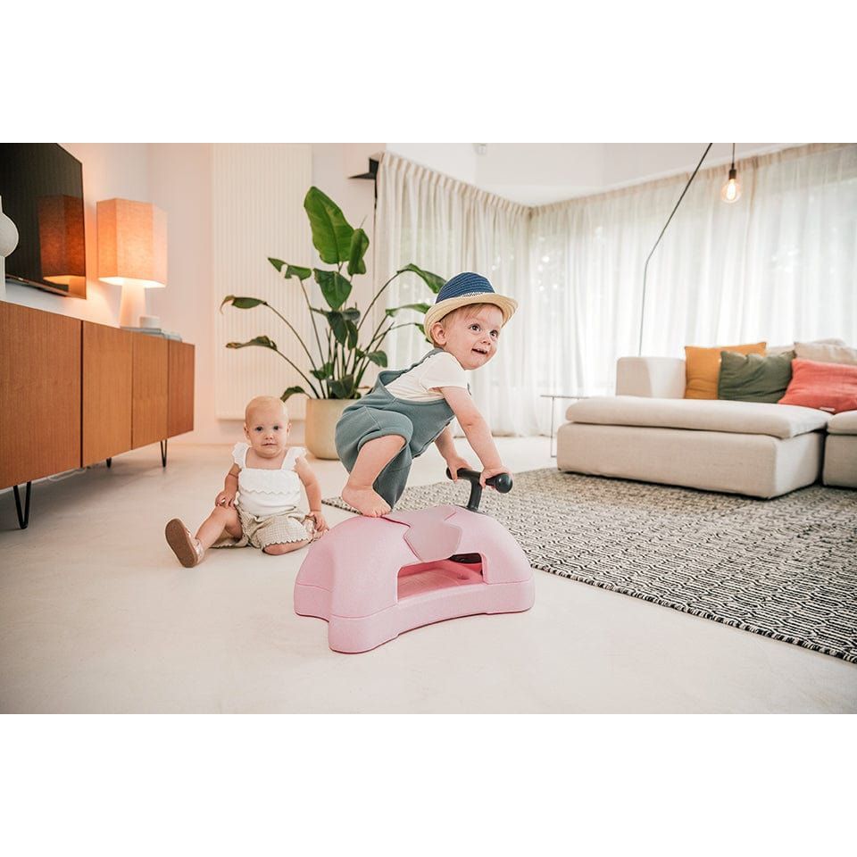 boy straddling Scoot and Ride My First 3-in-1 Baby Walker & Ride on - Rose