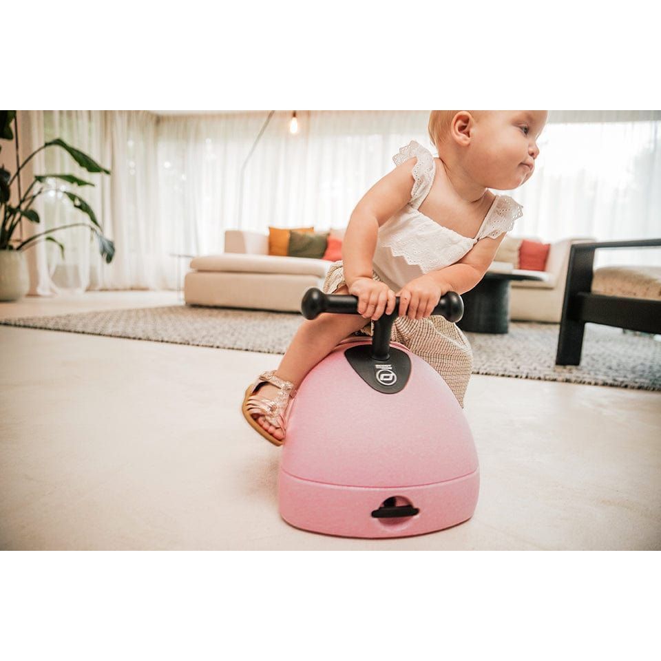baby girl sitting on Scoot and Ride My First 3-in-1 Baby Walker & Ride on - Rose from front