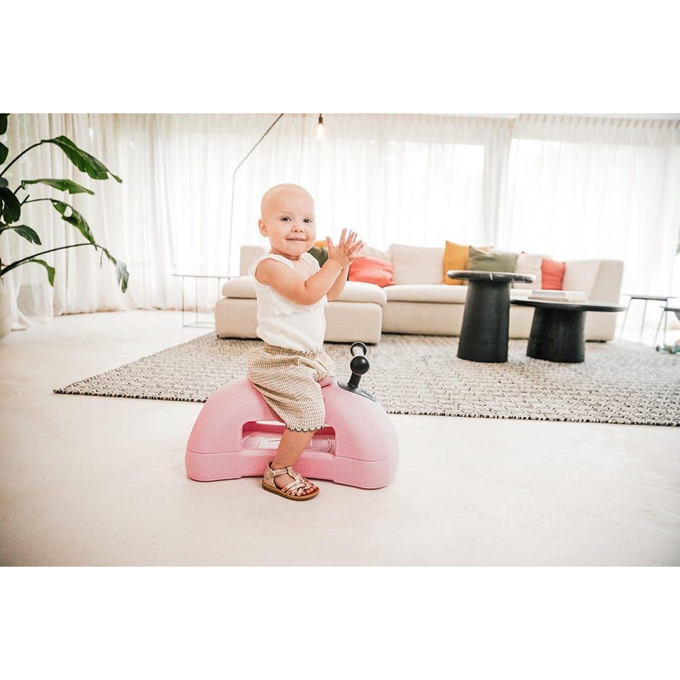 baby sitting on Scoot and Ride My First 3-in-1 Baby Walker & Ride on - Rose