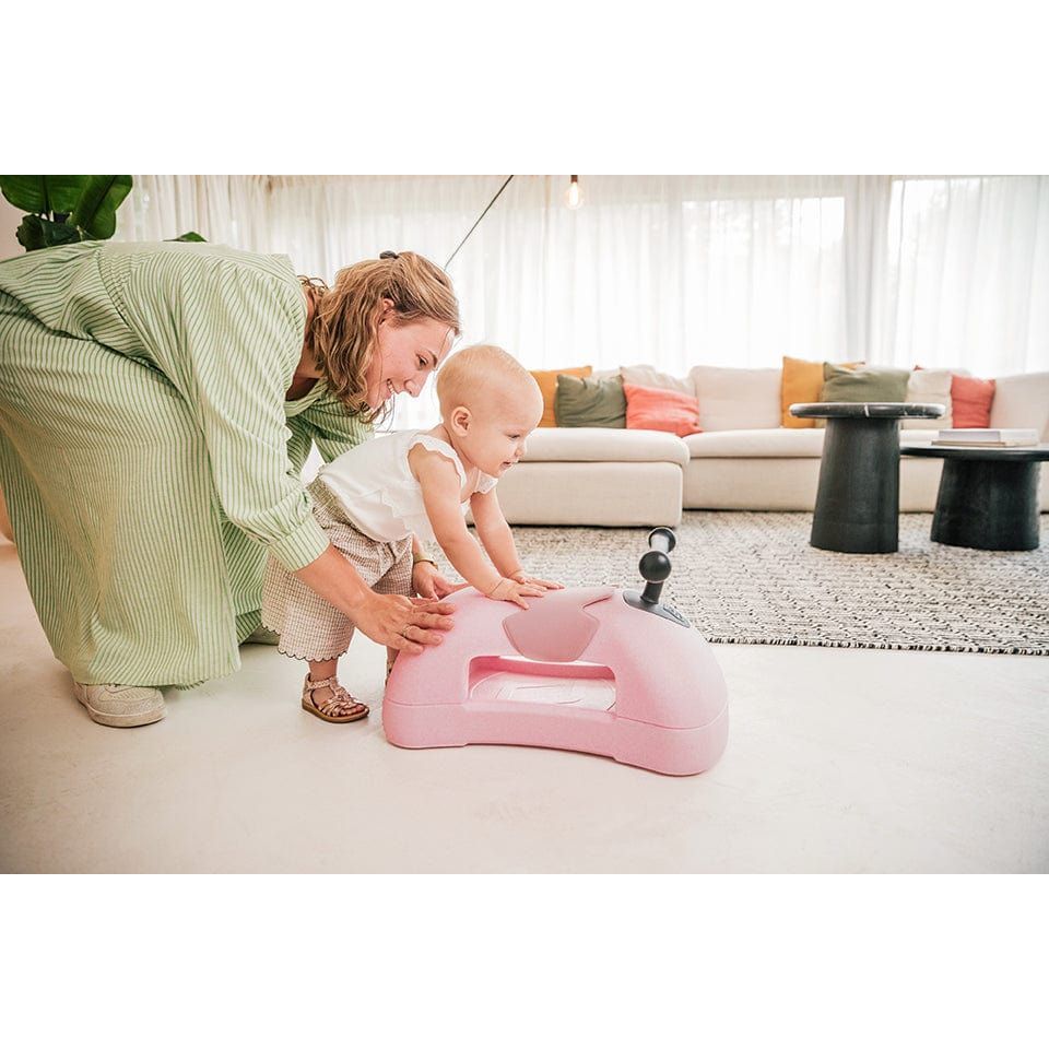 woman helping baby walk using Scoot and Ride My First 3-in-1 Baby Walker & Ride on - Rose