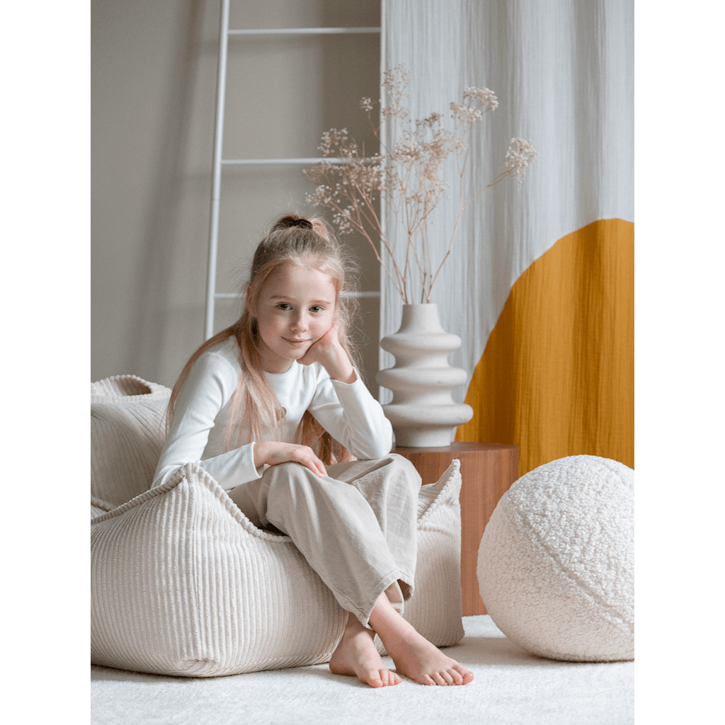 girl sitting in Wigiwama Marshmallow Beanbag Chair