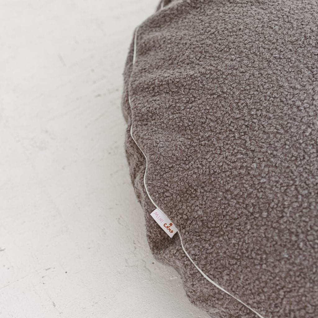 close up of fabrci from MINICAMP Boucle Fabric Kids Floor Cushion in Grey
